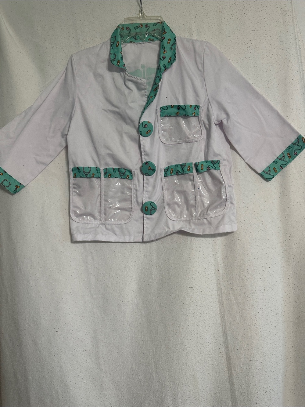 Melissa & Doug White Jacket with Teal Pattern Trim